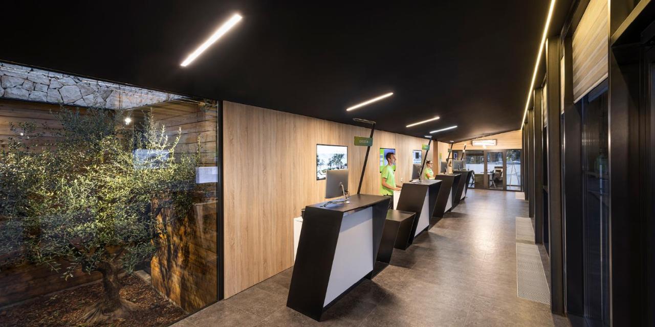 Aminess Style Glamping Villas & Holiday Homes Atea Njivice Exterior photo The reception area of the station